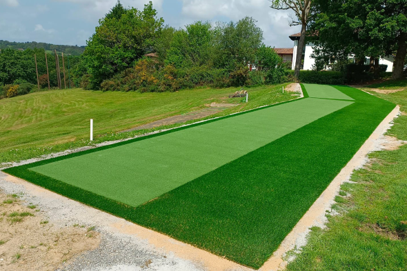 San Francisco Outdoor tee line consisting of one continuous green synthetic grass strip surrounded by trees