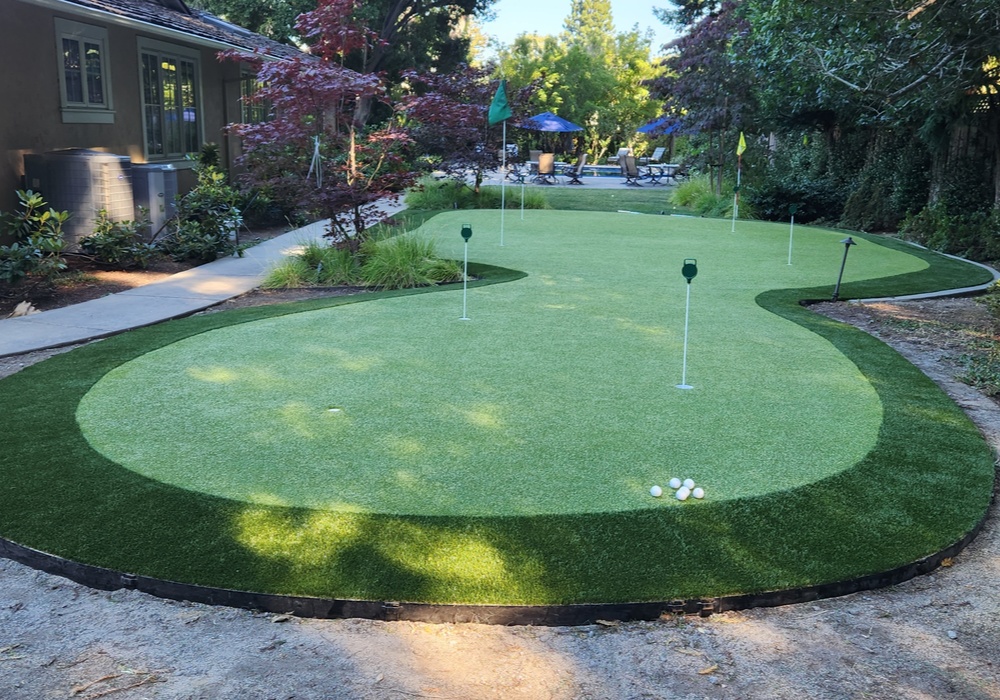 artificial grass putting green next to a house